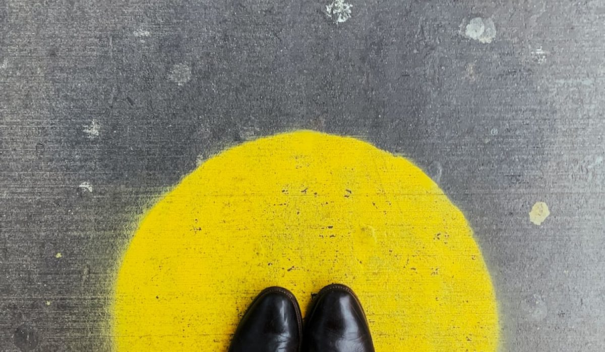 person standing on round yellow painted surface