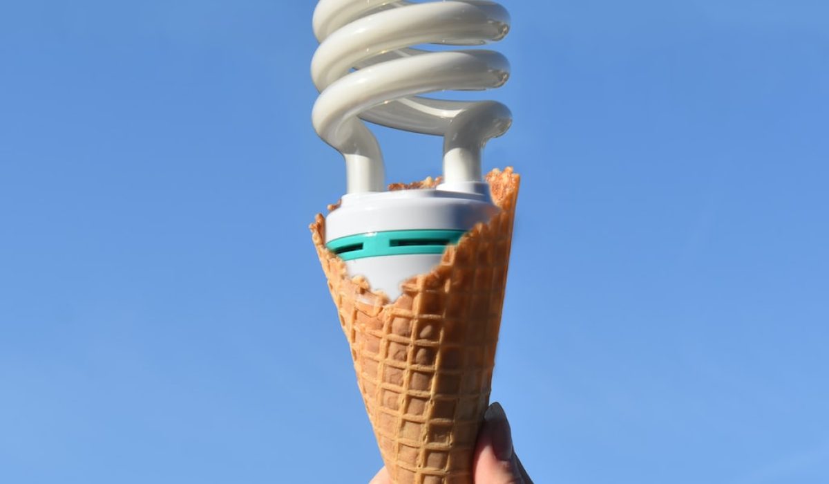 person holding white ice cream cone