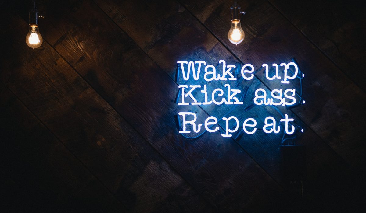 blue wake up kick ass repeat neon sign